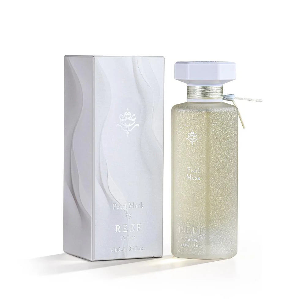 Pearl Musk perfume bottle and box, elegant design with shimmering gold accents