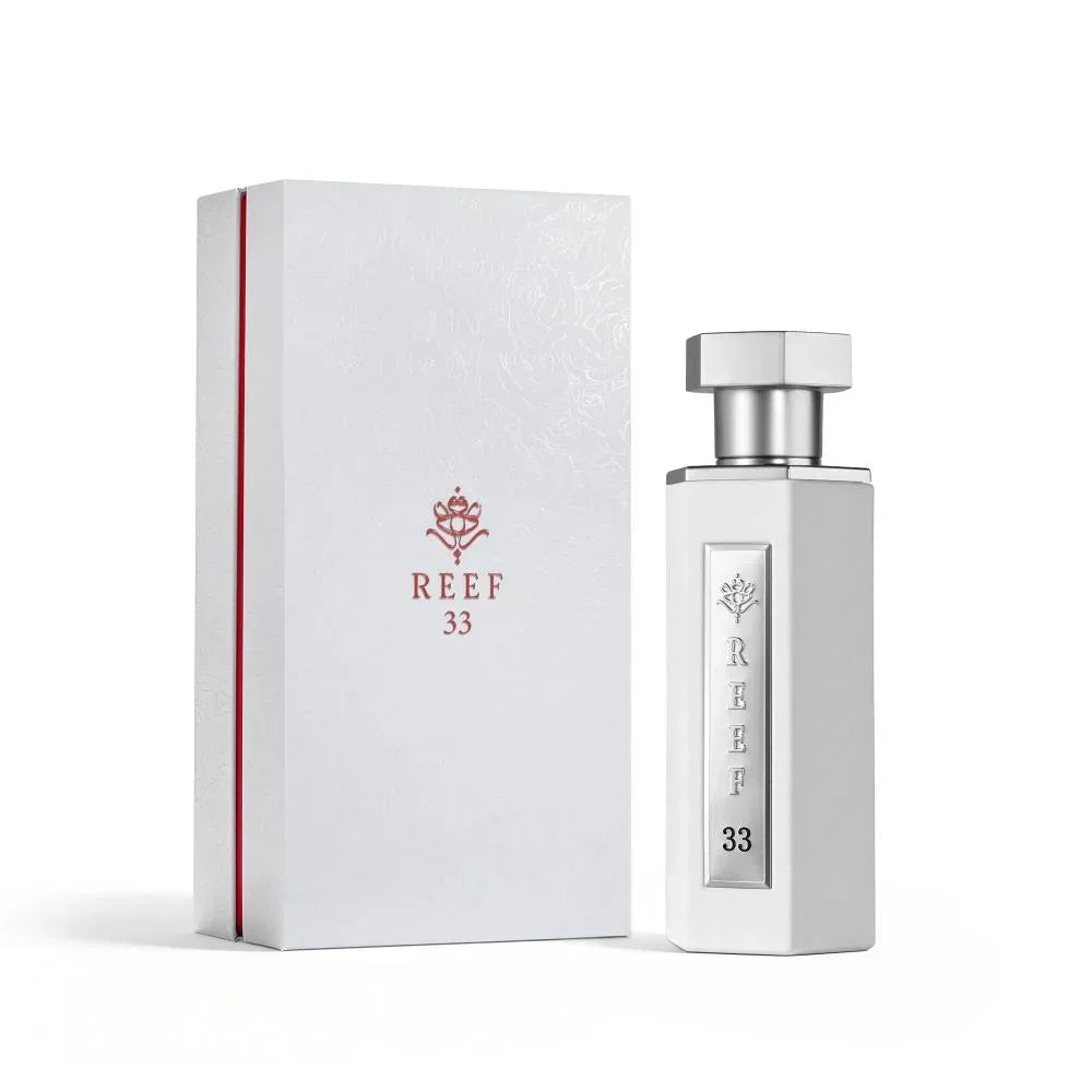 REEF 33 luxury perfume bottle and elegant white gift box with red accents