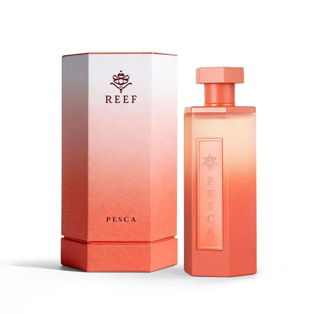 REEF Pesca perfume bottle and box with coral gradient design, elegant floral accents