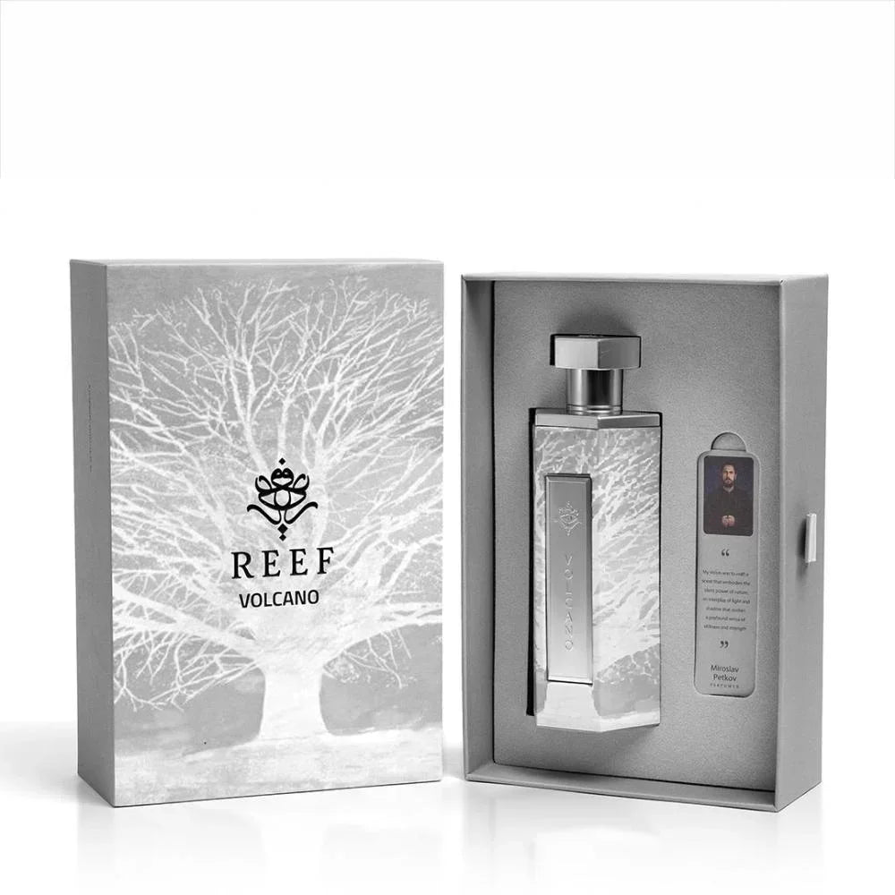 REEF Volcano perfume bottle in elegant silver packaging with tree design