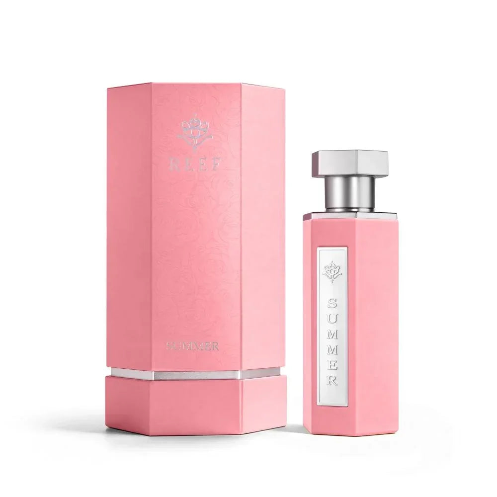 Pink REEF Summer perfume bottle and box, elegant design with silver accents