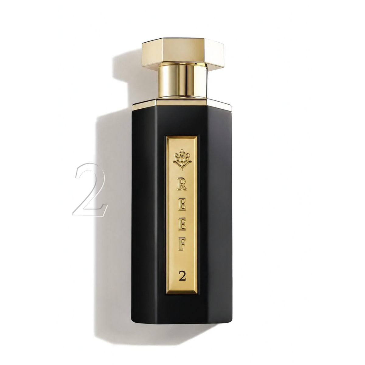 Elegant black and gold perfume bottle with REEF 2 label, evoking luxury and oriental fragrance notes