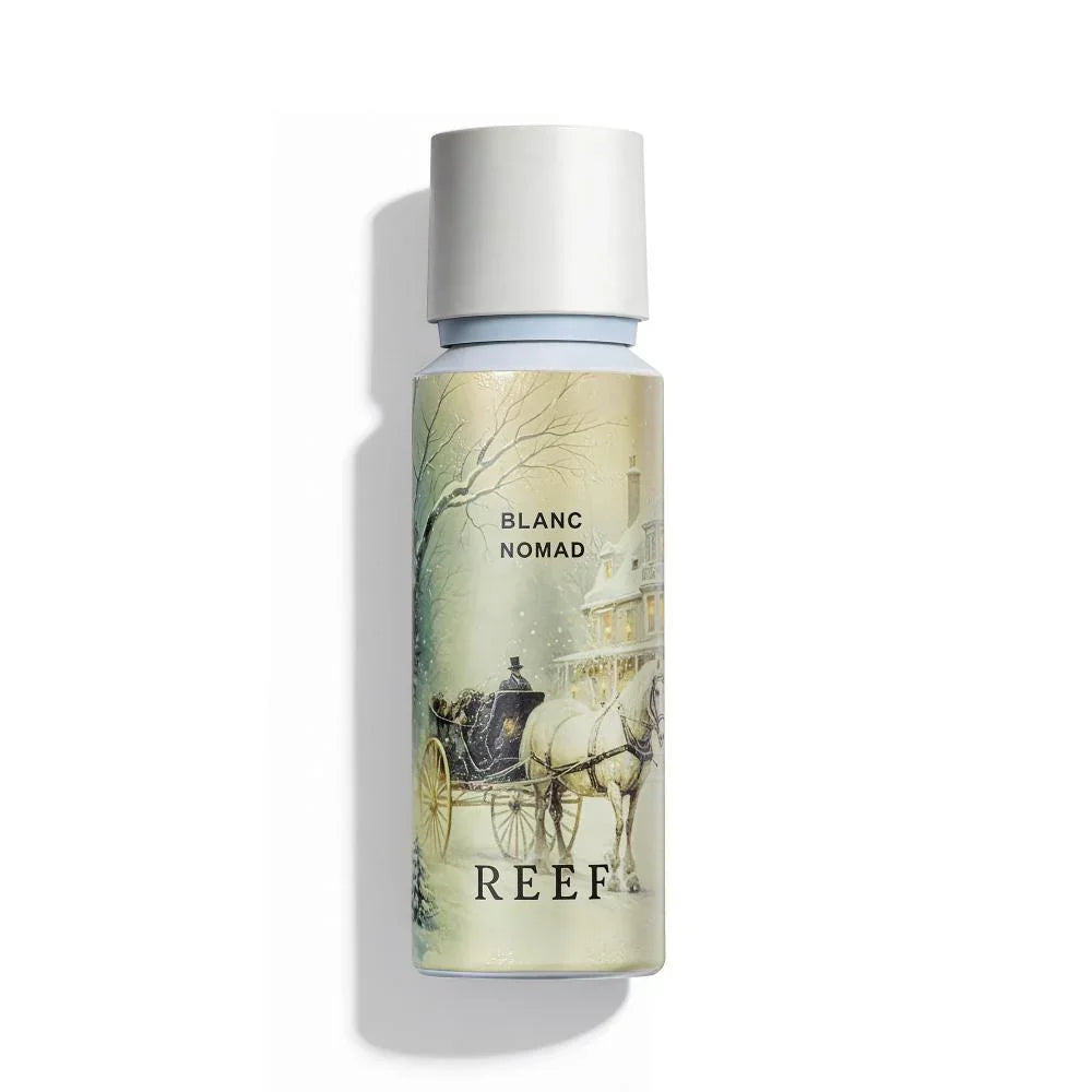Blanc Nomad perfume bottle with winter carriage scene, REEF branding