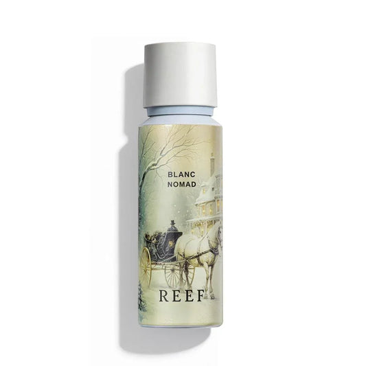 Blanc Nomad perfume bottle with winter carriage scene, REEF branding