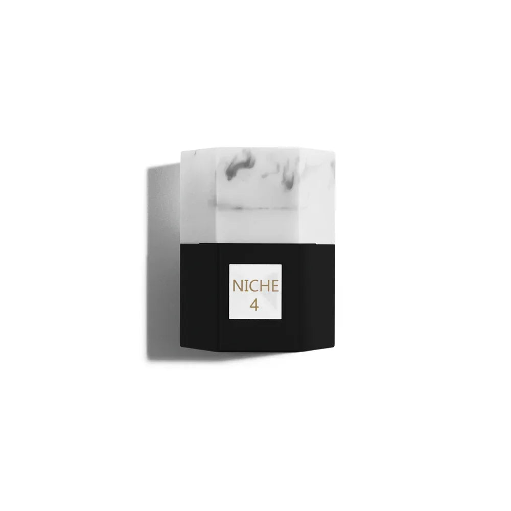 Niche 4 perfume bottle with marble cap and black base, elegant luxury fragrance design