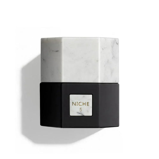 Niche 5 luxury perfume bottle with marble cap and black base, elegant fragrance design