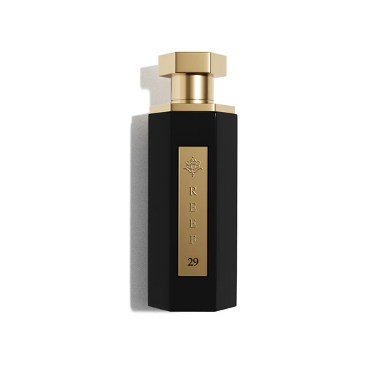 Elegant black perfume bottle with gold accents, REEF 29, luxury fragrance design
