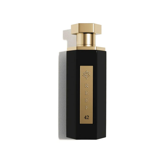 Elegant black perfume bottle with gold accents, labeled REEF 42, evoking luxury and oriental fragrance notes