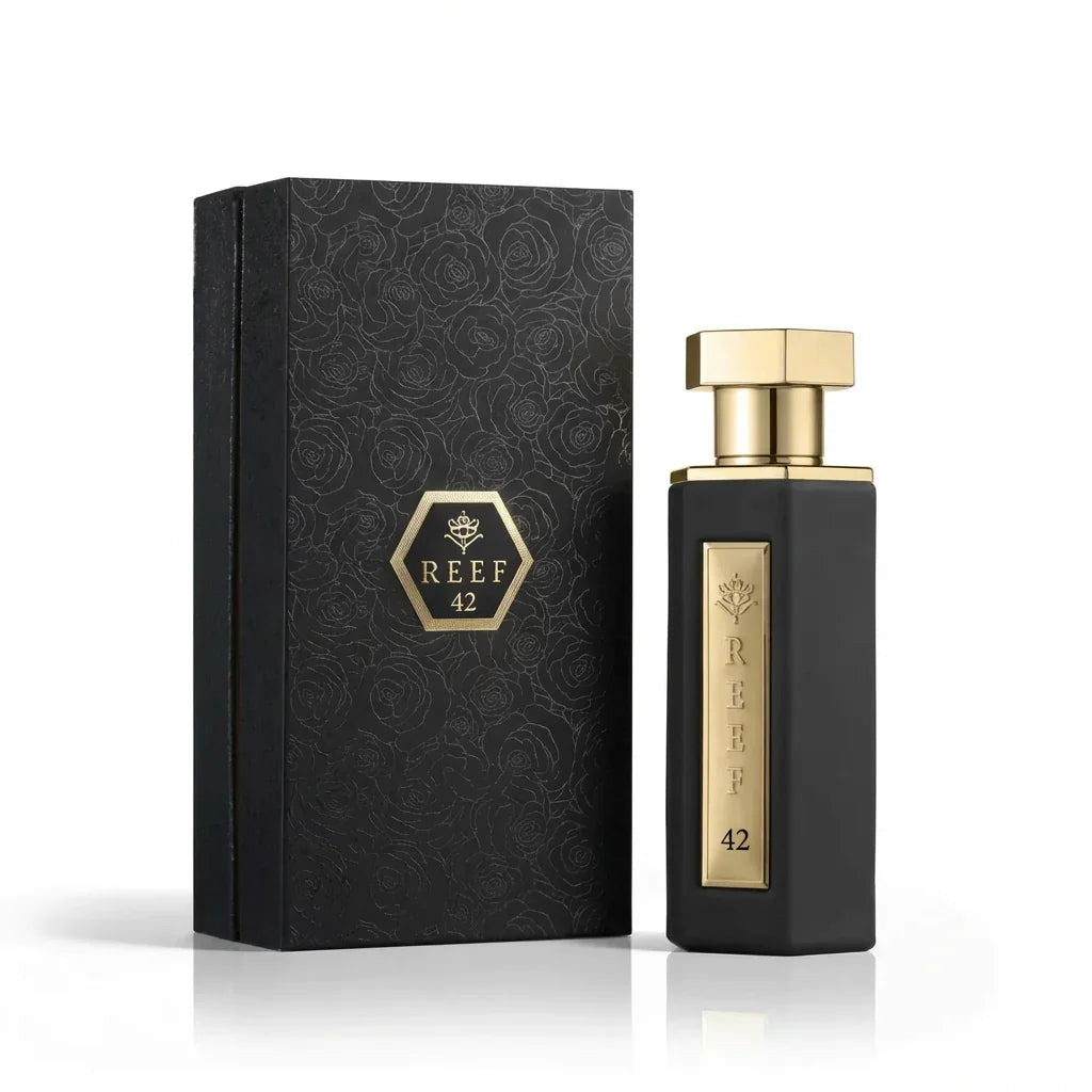 REEF 42 luxury perfume bottle with black rose-patterned gift box, elegant gold accents