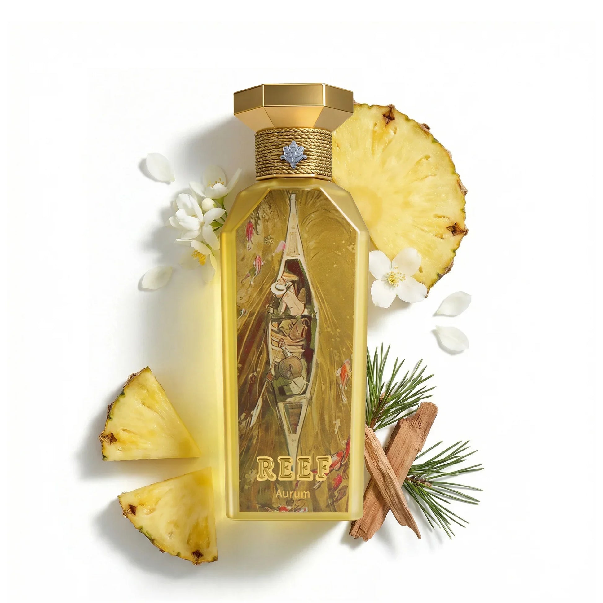 REEF Aurum perfume bottle with pineapple slices, white flowers, and cinnamon sticks