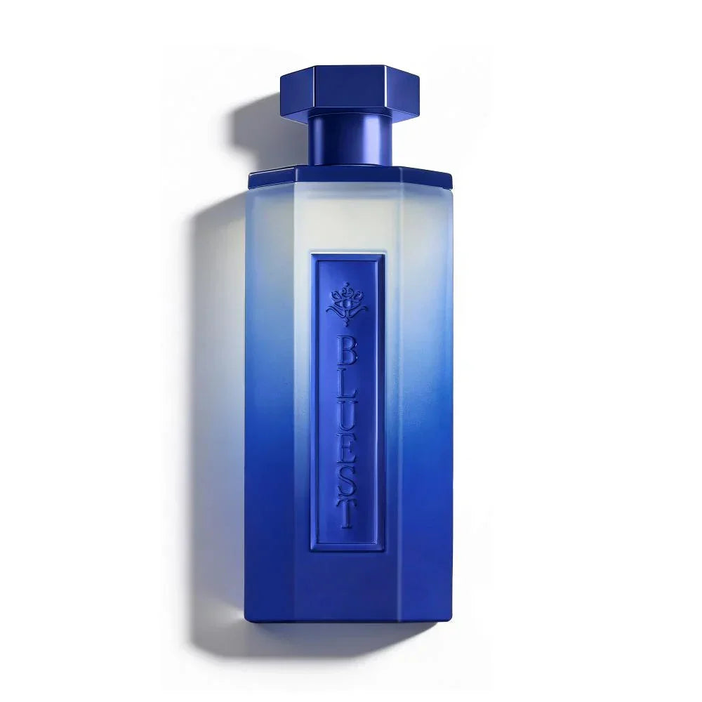 Elegant blue gradient perfume bottle with embossed design, evoking luxury and oriental essence