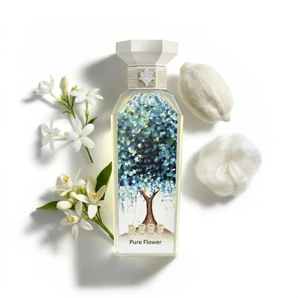 REEF Pure Flower perfume bottle with white blooms and cotton, evoking floral freshness