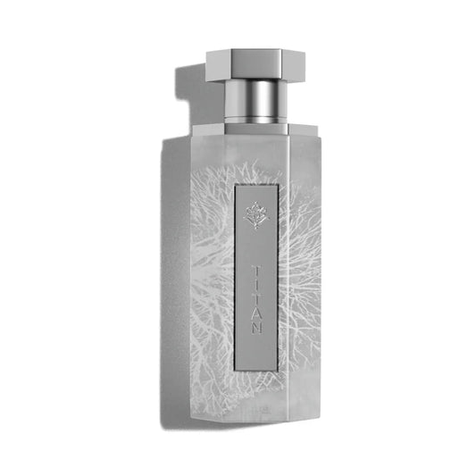 Elegant silver perfume bottle with 'TITAN' label and intricate floral design, evoking luxury and oriental essence